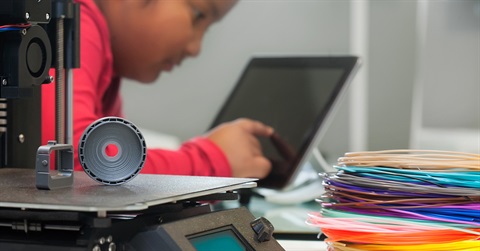 Girl using 3d printer