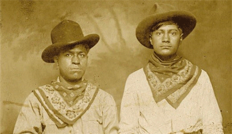 Historical picture of cowboys wearing their bandanas.