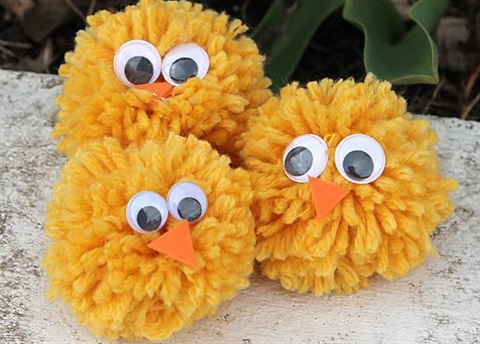 little fuzzy birds made of yarn and googly eyes