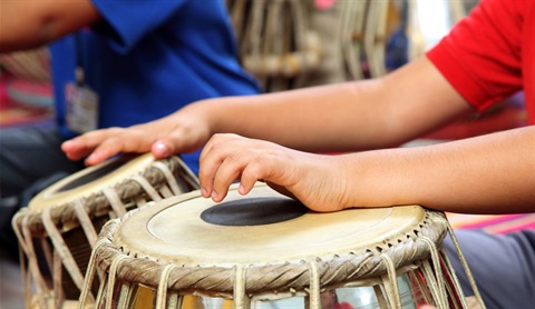 Child playing drum