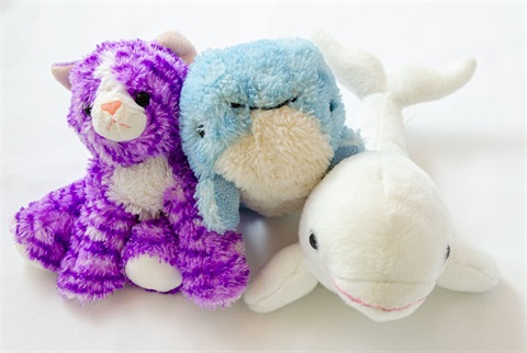 Three stuffed animals sitting together