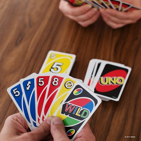 photo of people playing the game Uno