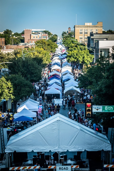 a street view of booths and people