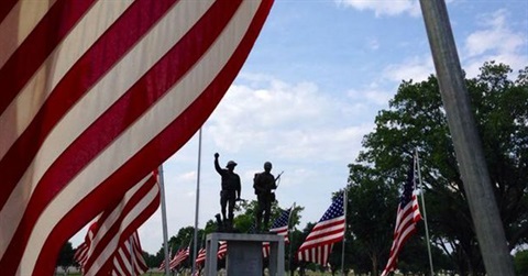memorial day flags in a cemetery 